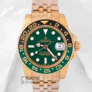 "GMT 40 Yellow Gold Watch with Green Dial and Matching Bezel "