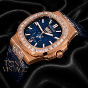 Moon Phase Rose Gold Watch with Stone Bezel, Blue Dial, and Leather Strap