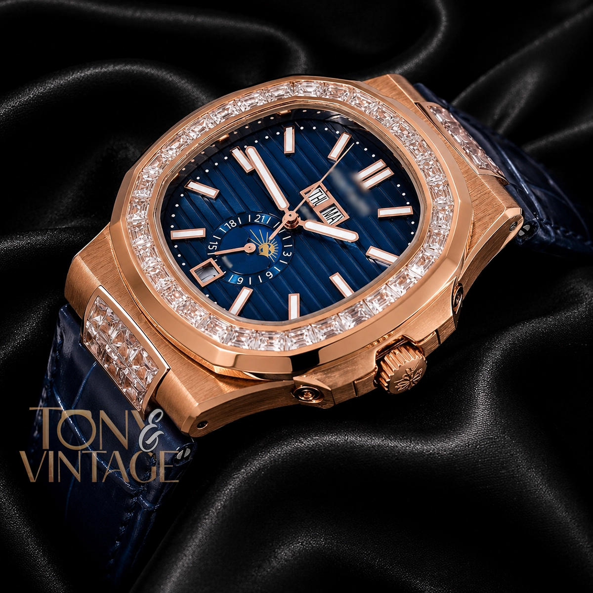 Moon Phase Rose Gold Watch with Stone Bezel, Blue Dial, and Leather Strap