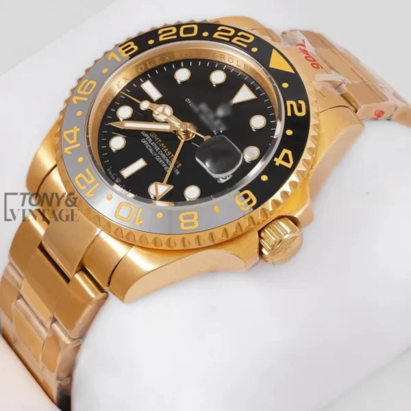 GMT-40-Yellow-Gold-Watch-with-Black-Dial-Bezel1.webp