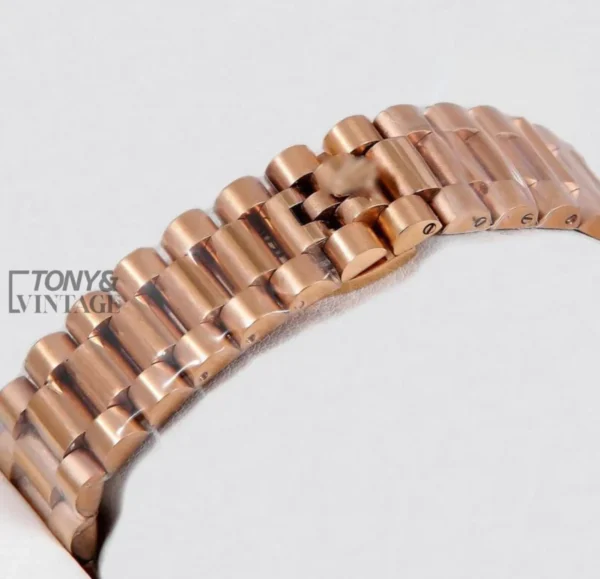 Rose Gold Watch with Chocolate Brown Dial, Stone Numerals, and Fluted Bezel