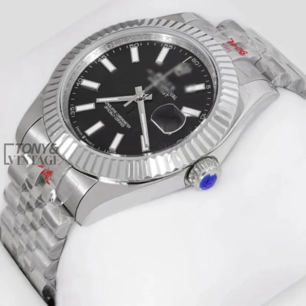 Silver-Automatic-Watch-with-Black-Dial-and-Fluted-Bezel1.webp
