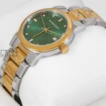 TWO TONE YELLOW GOLD WITH GREEN DIAL & STONE FIGURE LADIES WATCH