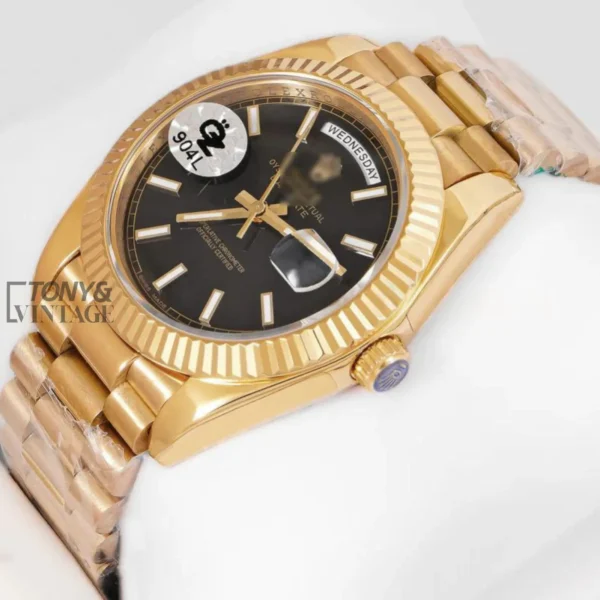 Yellow-Gold-Automatic-Watch-with-Black-Dial-and-Fluted-Bezel-1.webp