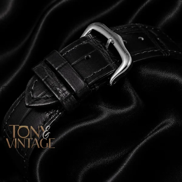 Silver Watch with Gold Bezel, Dial, and Leather Strap